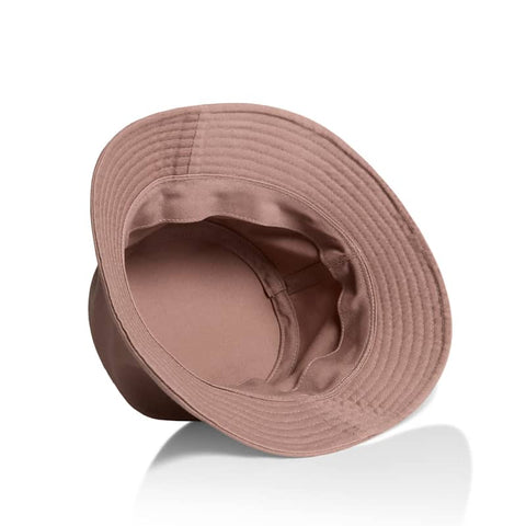 A brown bucket hat with a wide brim and a soft interior lining, featuring a logo inside.